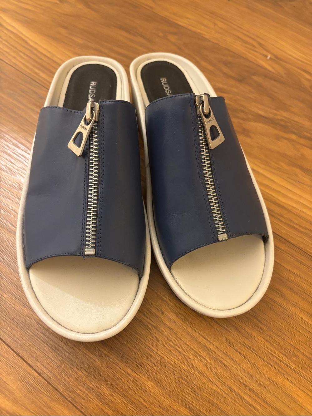 RUDSAK Navy Leather Zip-Front Slide Mules with Cream Footbed